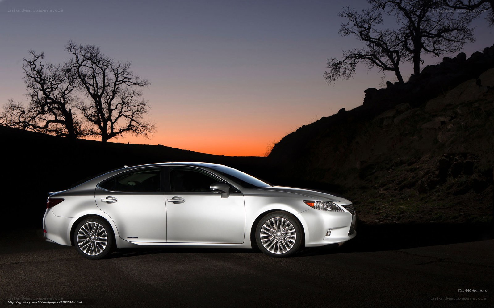 Silver sedan at sunset