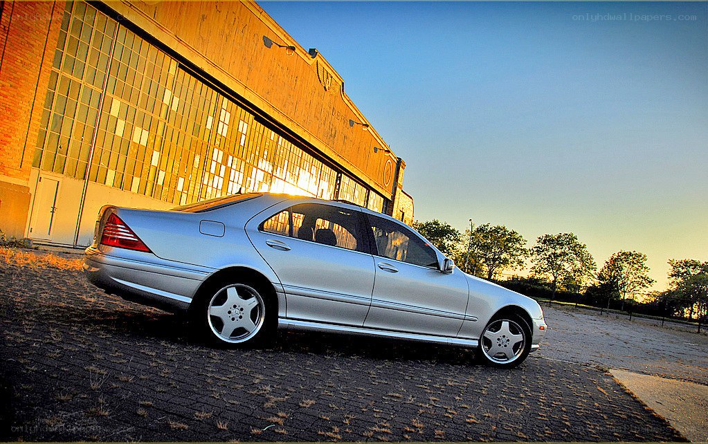 silver sedan at sunset