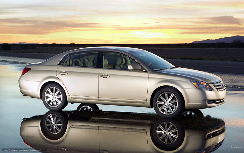 silver sedan at sunset