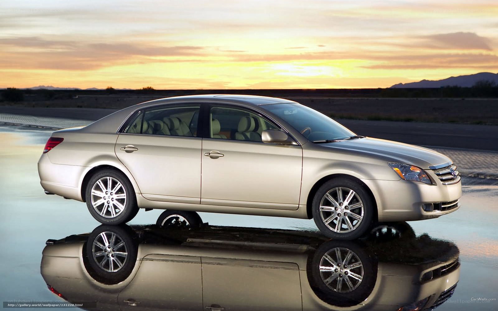 silver sedan at sunset