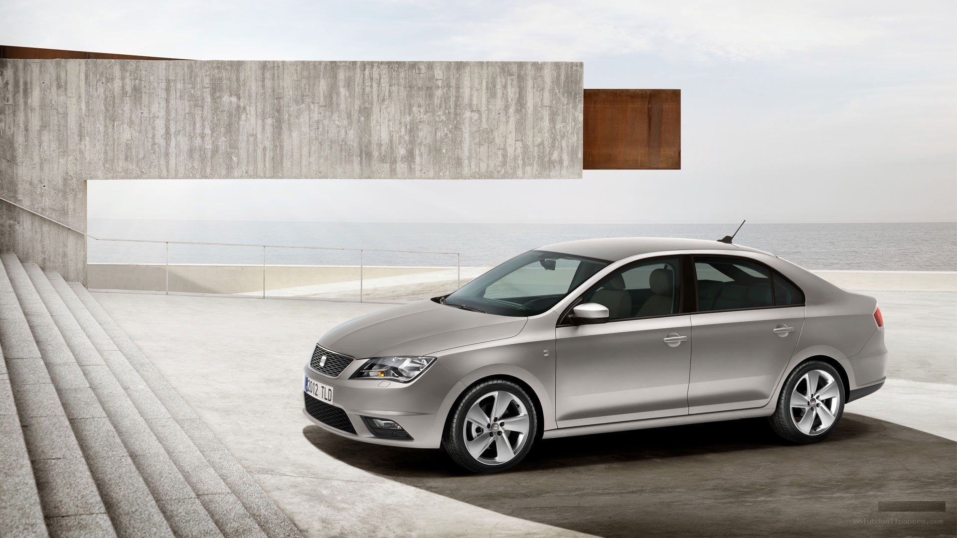 Silver sedan by the sea
