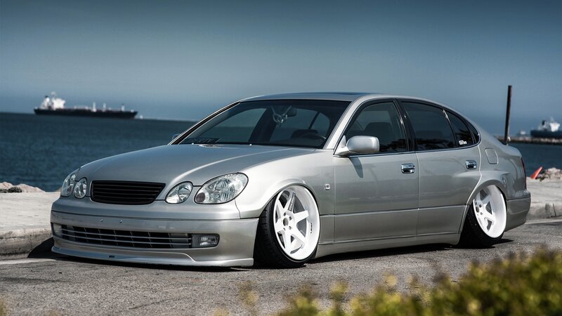 silver sedan by the sea