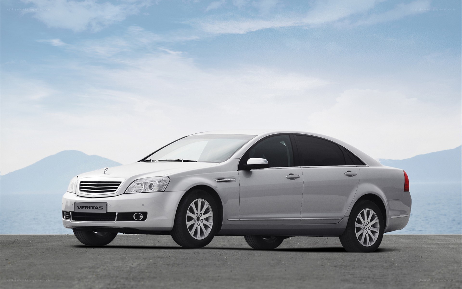 Silver sedan by the sea