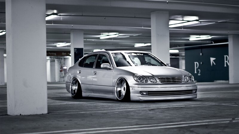 Silver Sedan Car — Gray, Dramatic, Photograph, Parking Garage