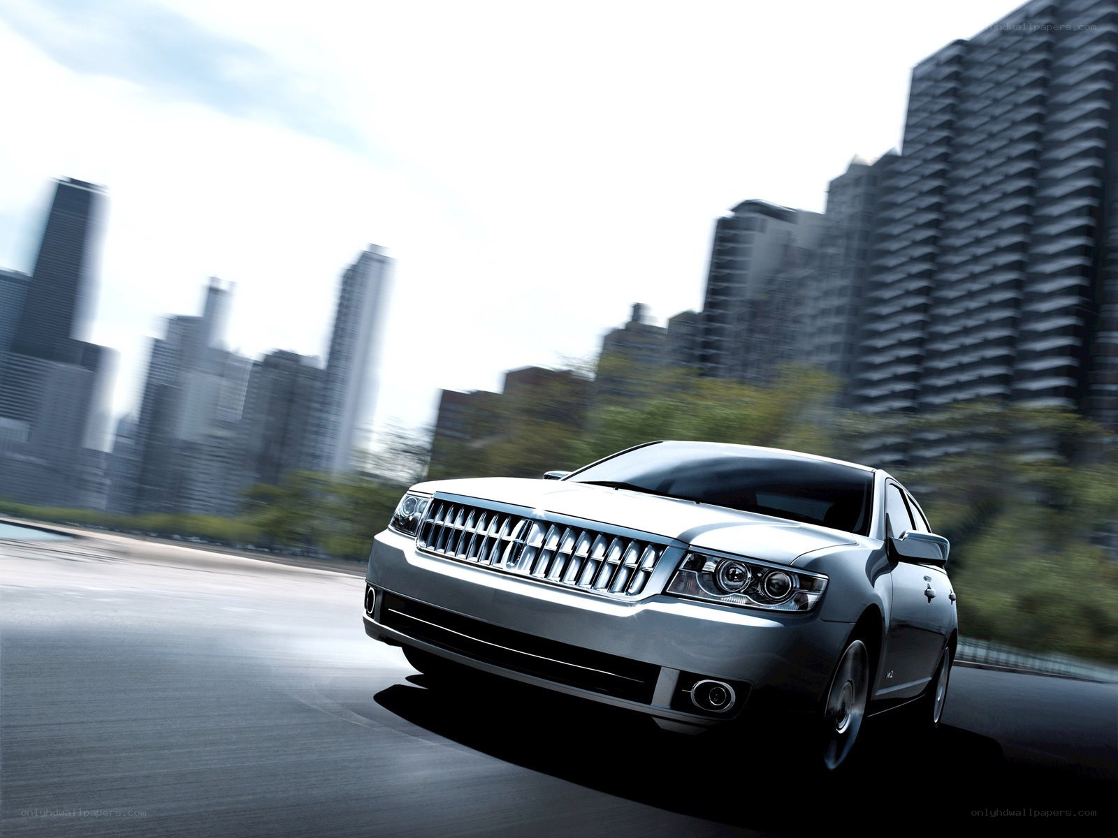silver sedan in city