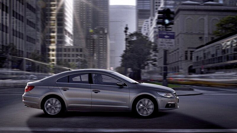 Silver sedan in city traffic