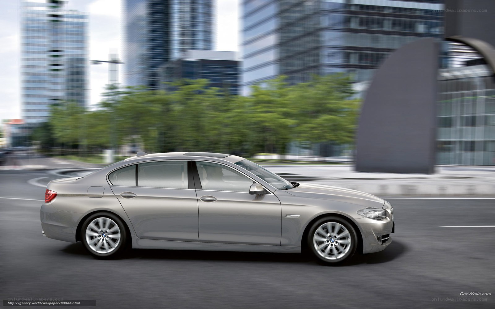 silver sedan in city