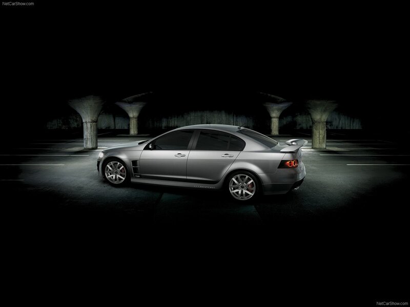 silver sedan in dark parking