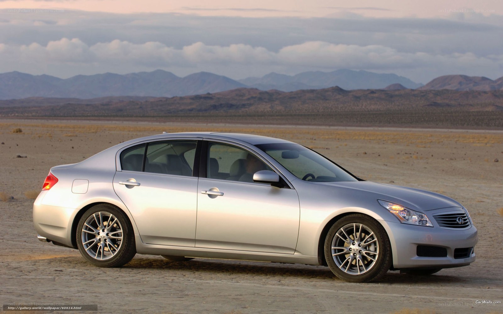 silver sedan in desert landscape