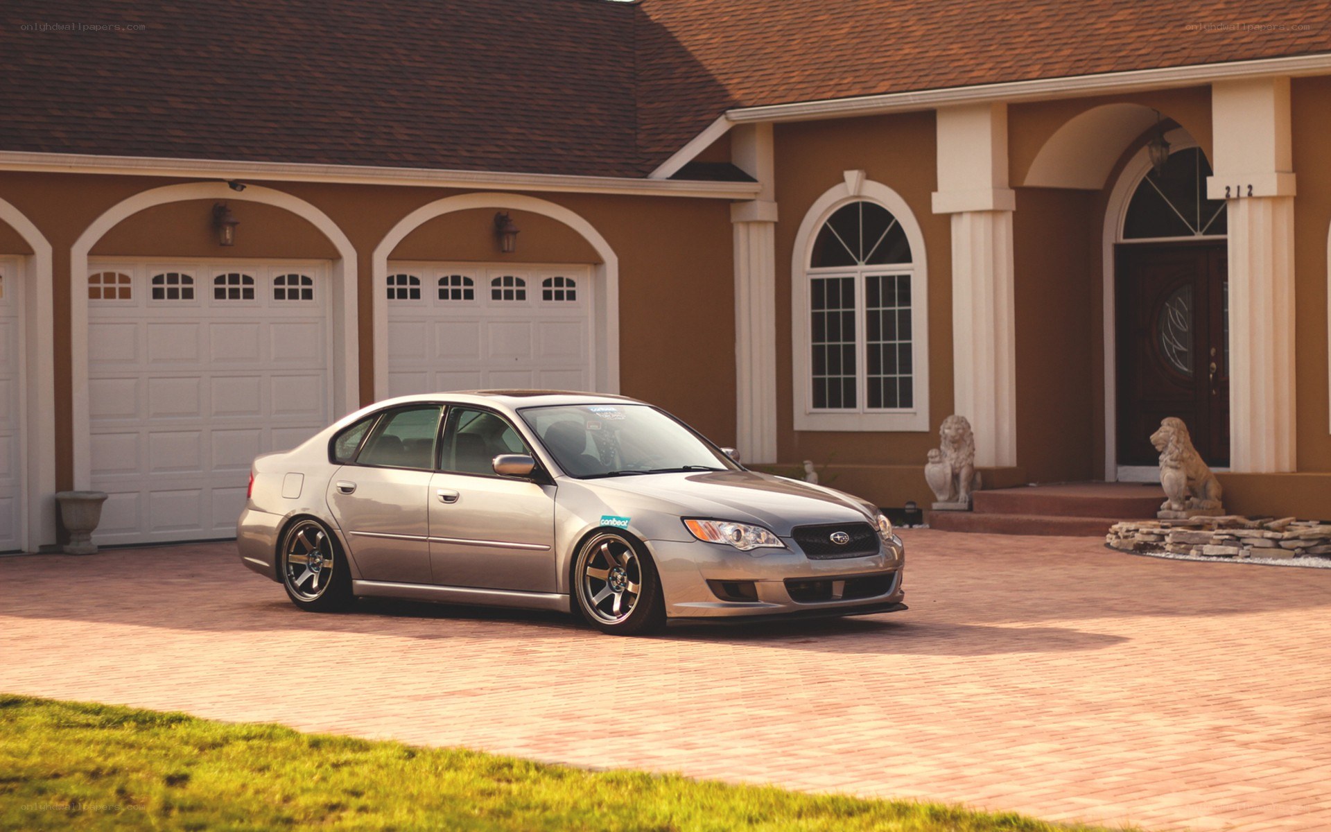 silver sedan in driveway