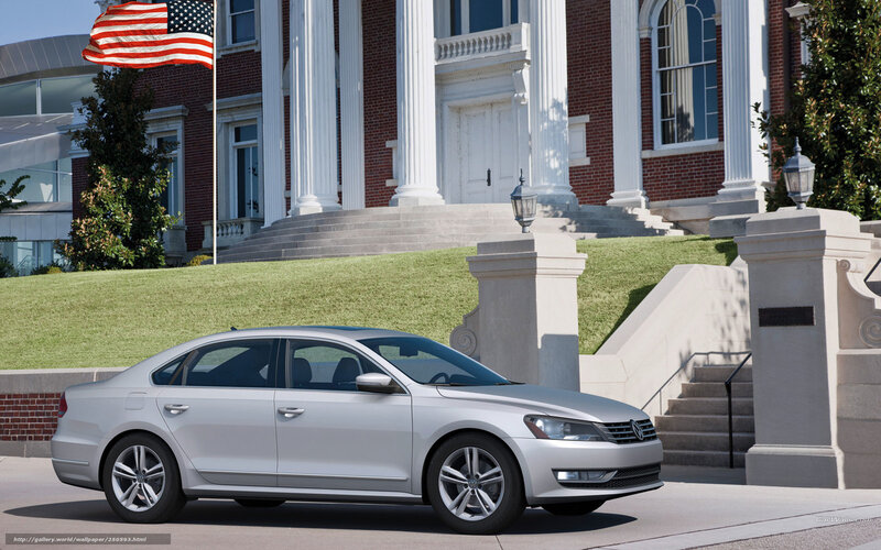 Silver sedan in front of a building