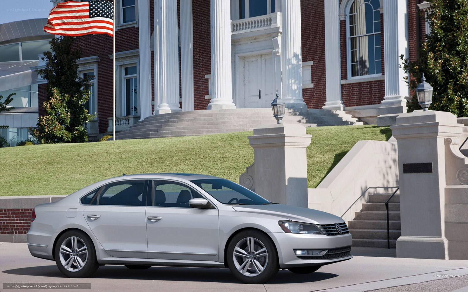 Silver sedan in front of a building