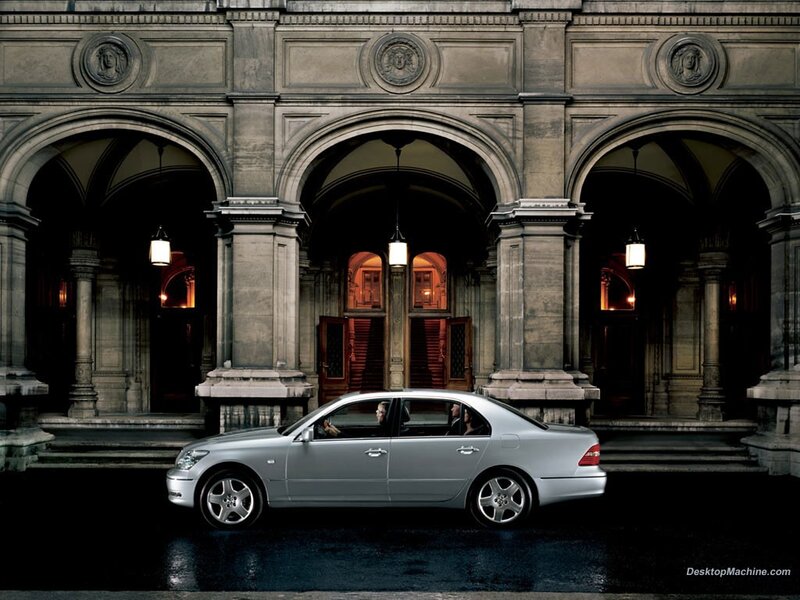 Silver sedan in front of arches