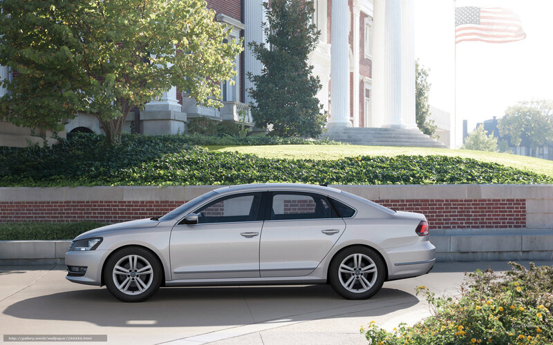 Silver sedan in front of building