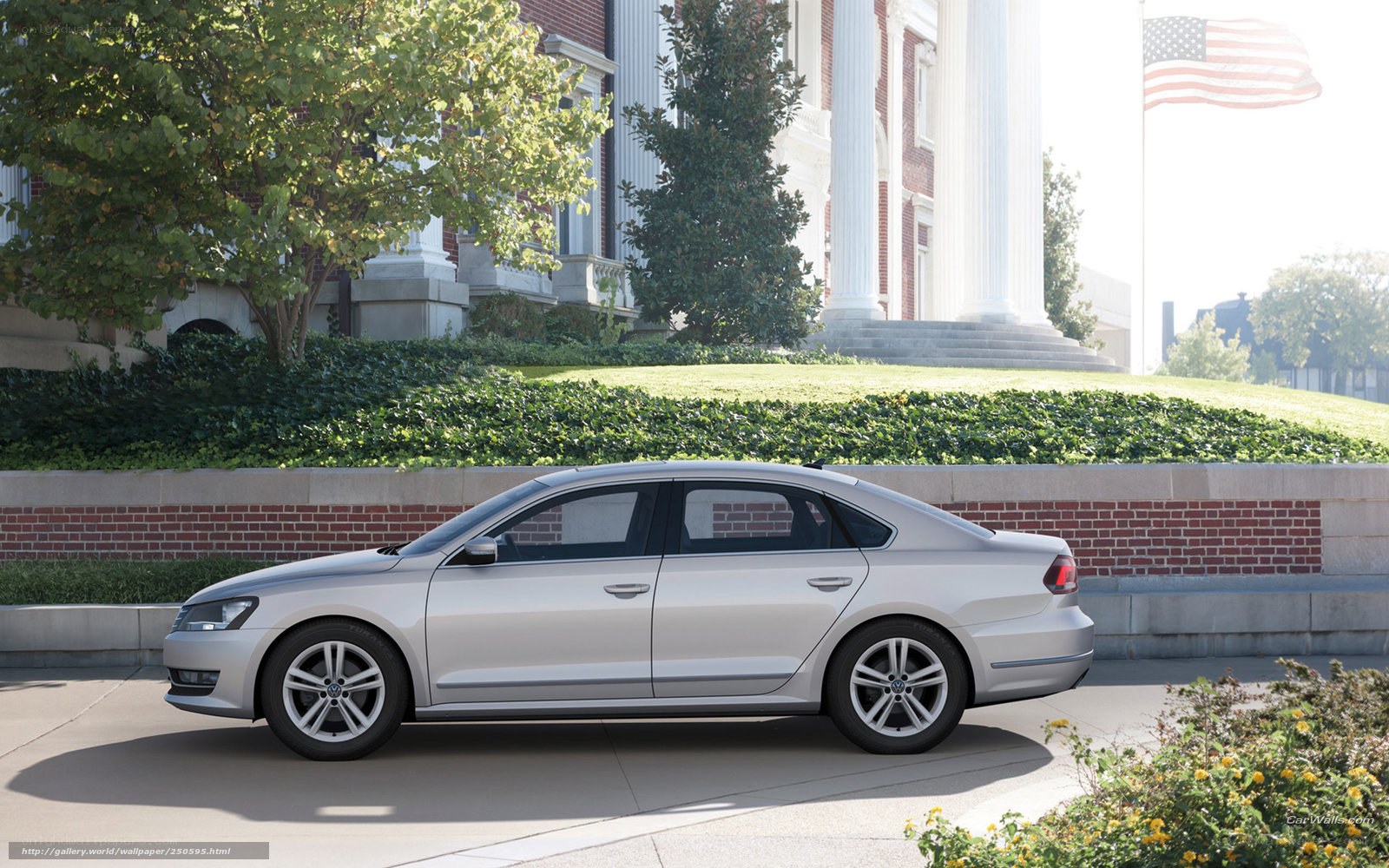 Silver sedan in front of building