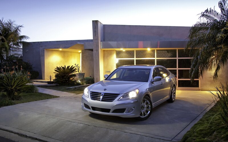 Silver sedan in front of modern home