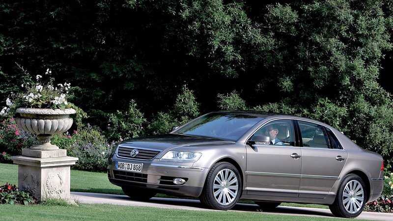 Silver sedan in garden setting