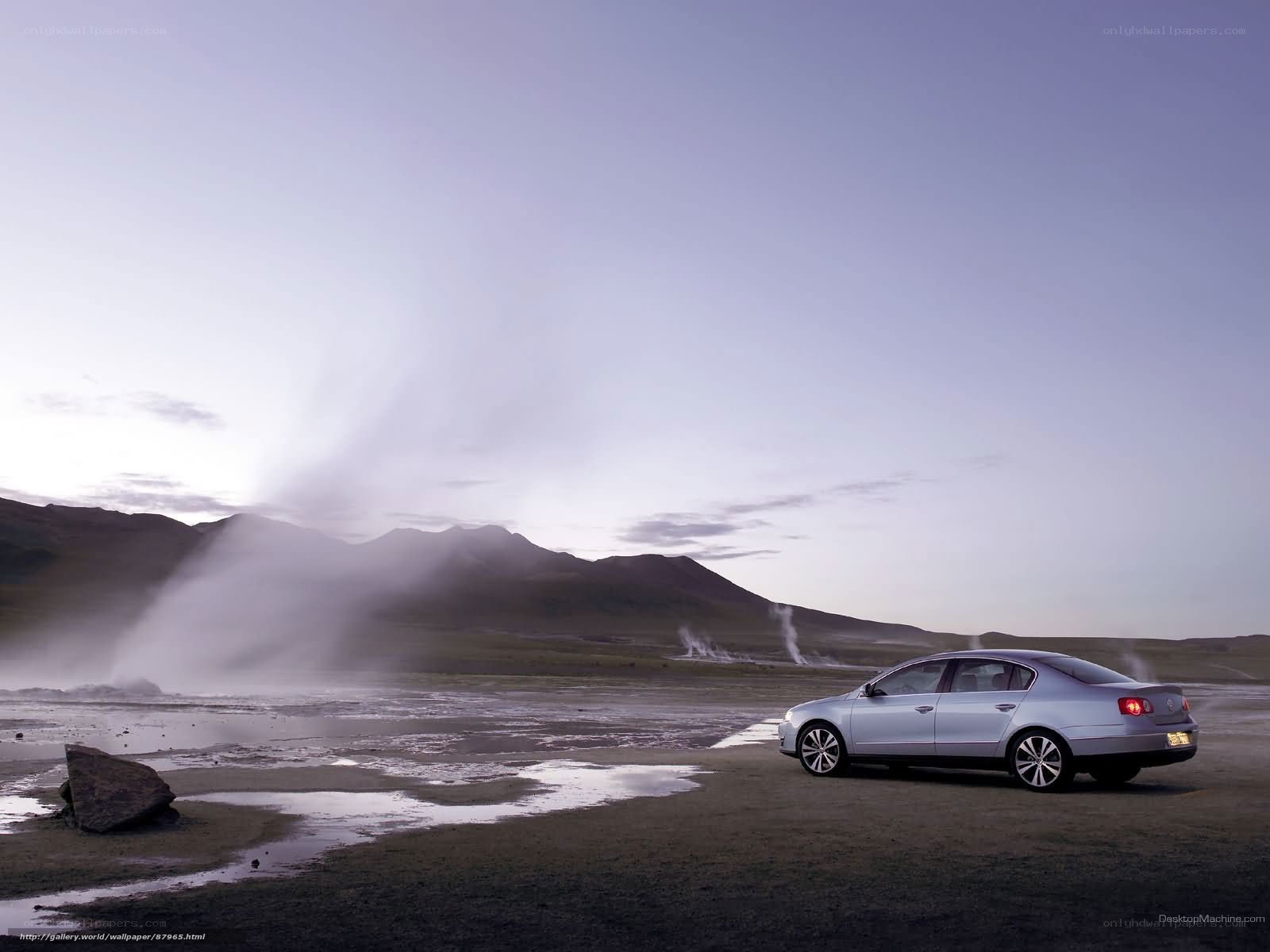 Silver sedan in geothermal landscape