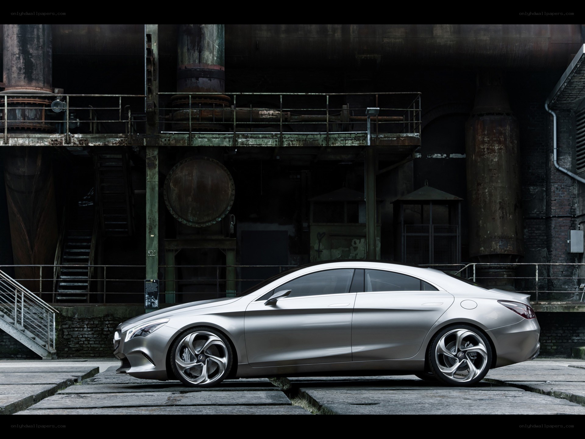 Silver sedan in industrial setting