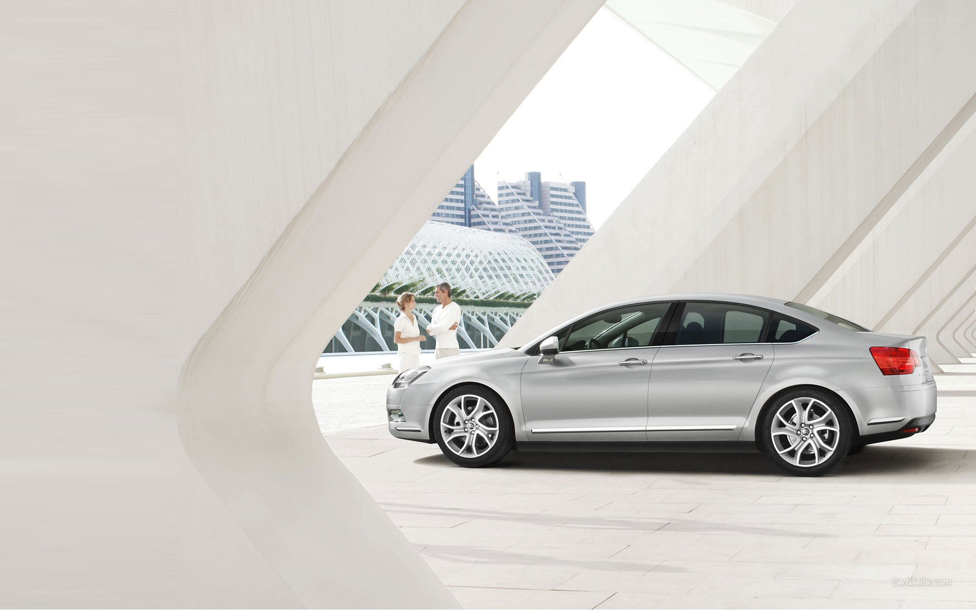 Silver sedan in modern architecture