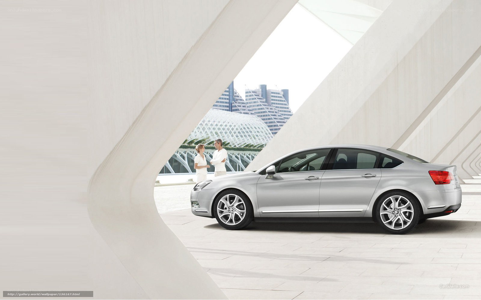 Silver sedan in modern architecture
