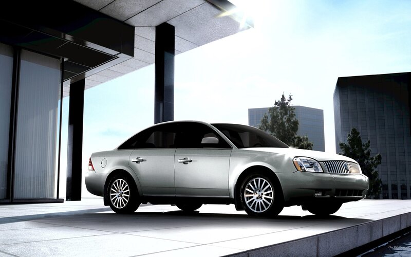silver sedan in modern city