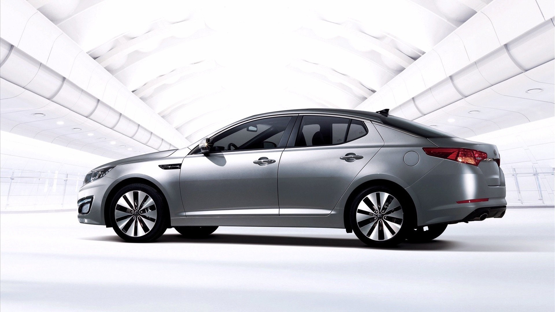silver sedan in modern setting
