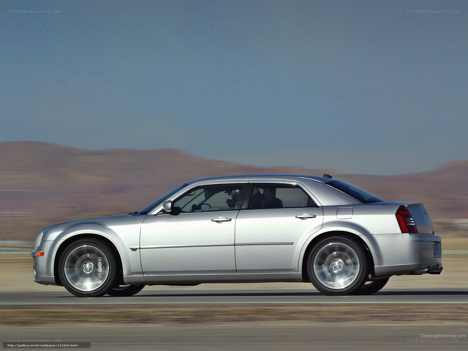 silver sedan in motion