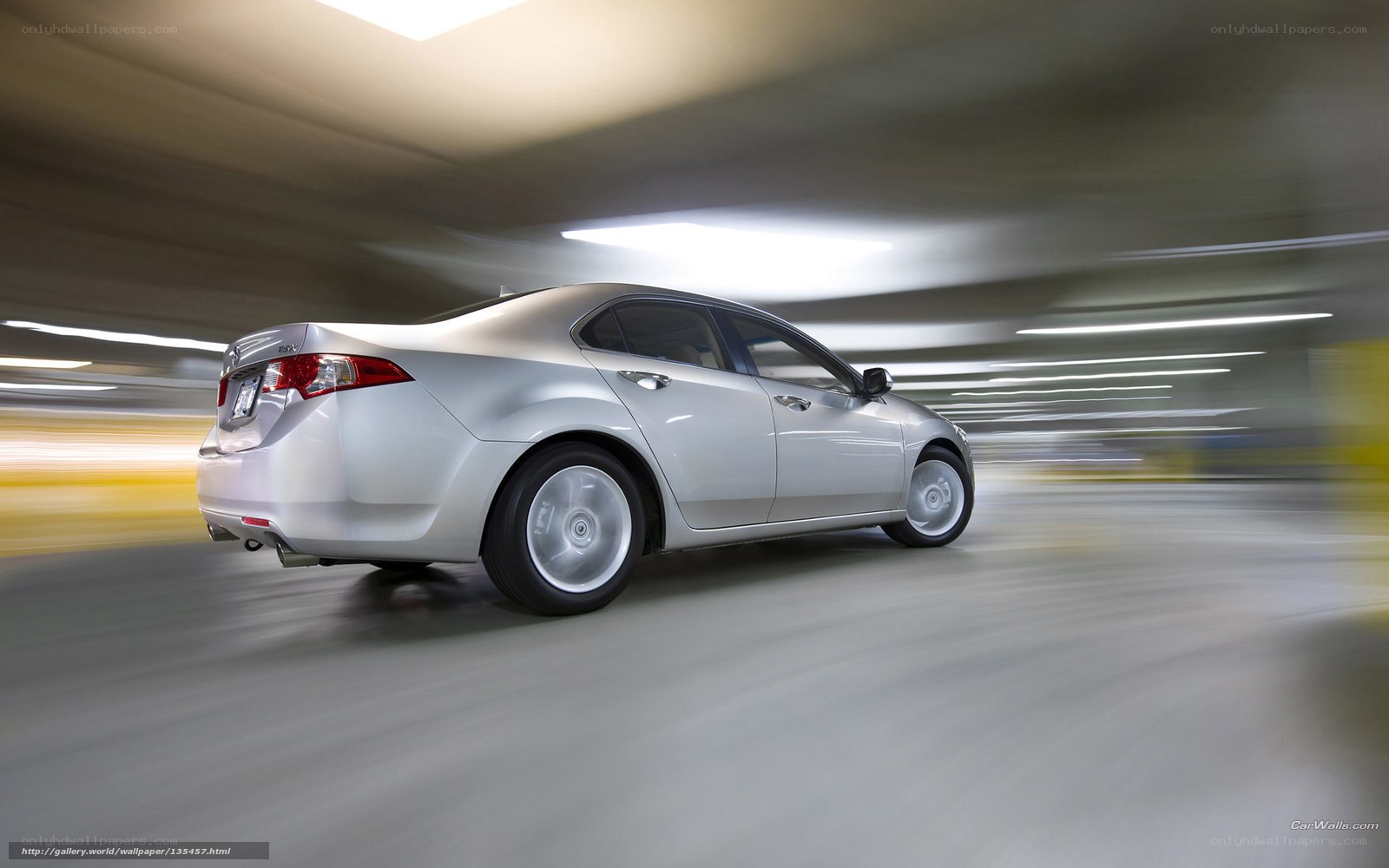silver sedan in motion
