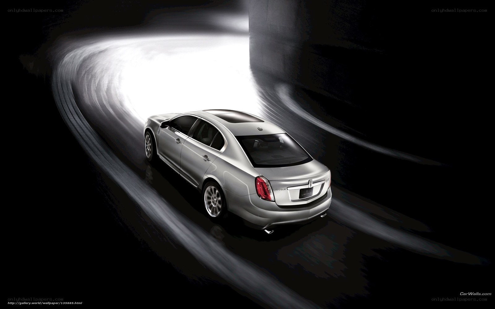 silver sedan in motion