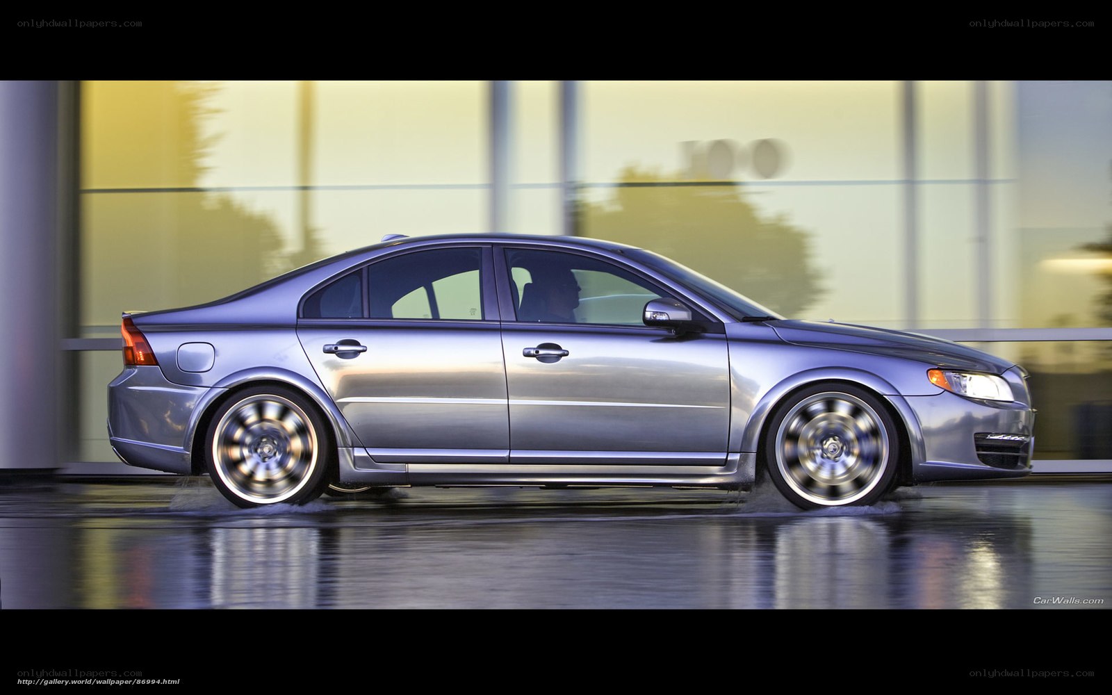 silver sedan in motion