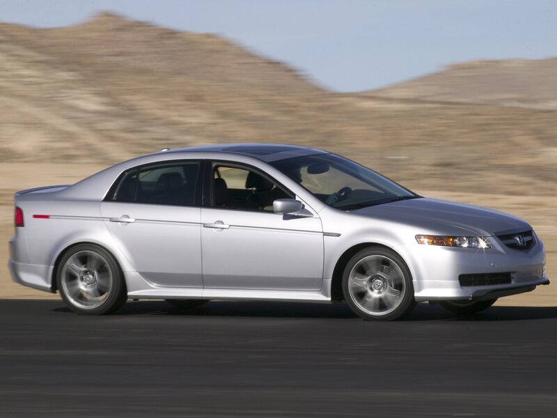 silver sedan in motion