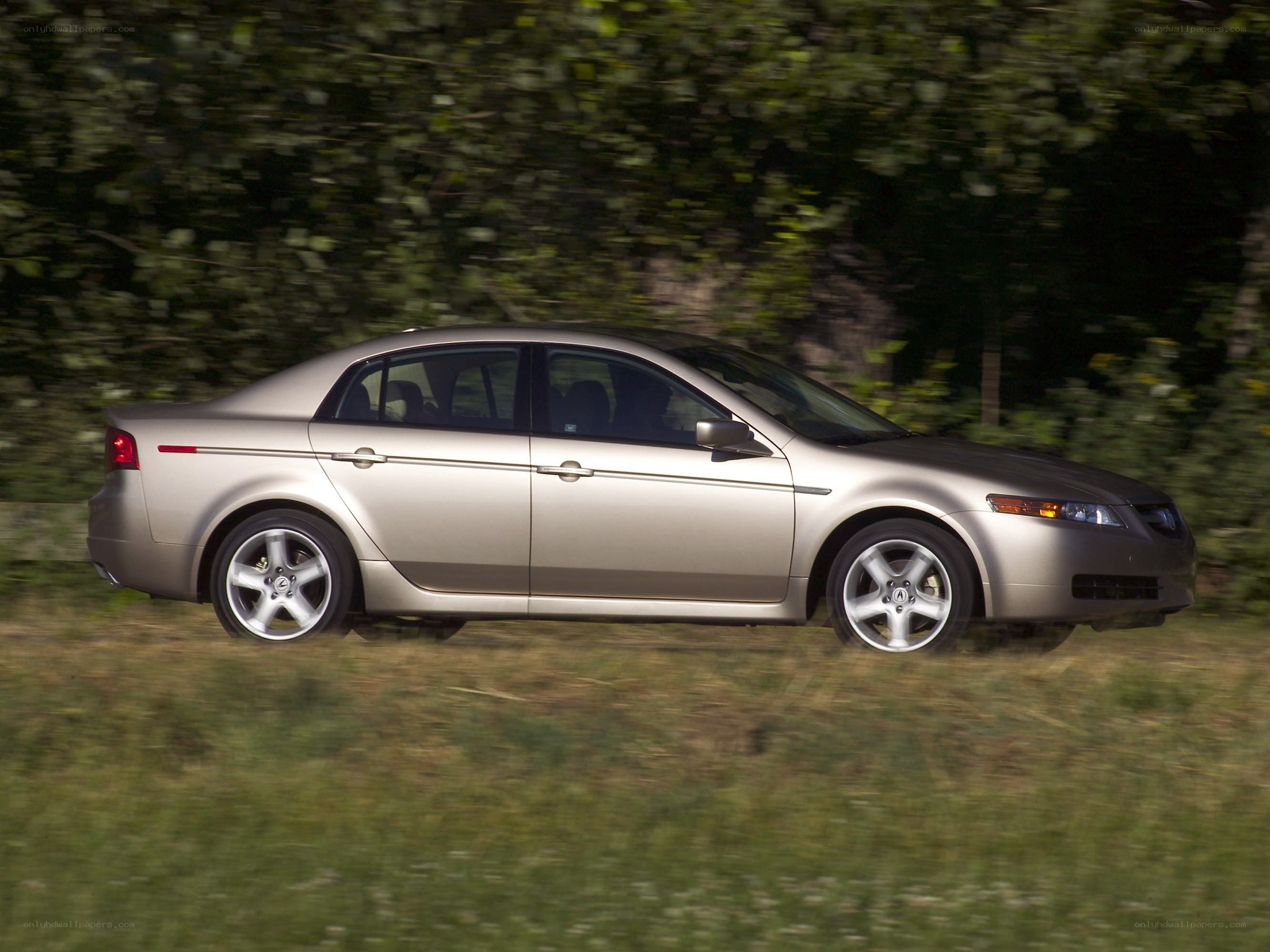 silver sedan in motion