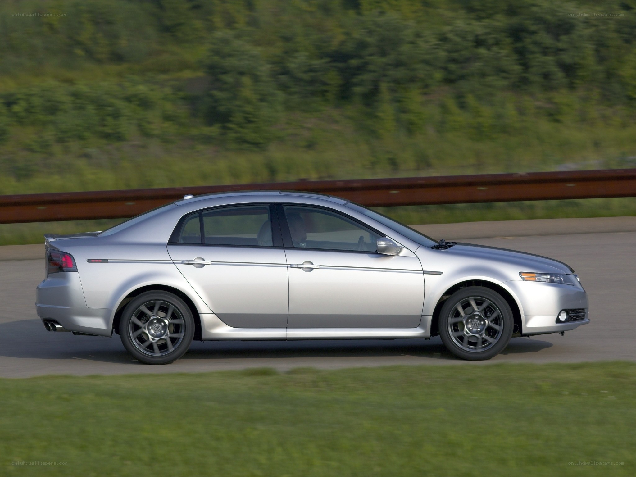 silver sedan in motion