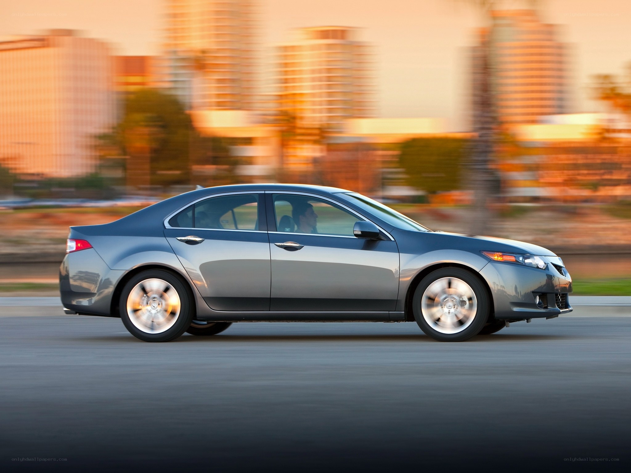 silver sedan in motion