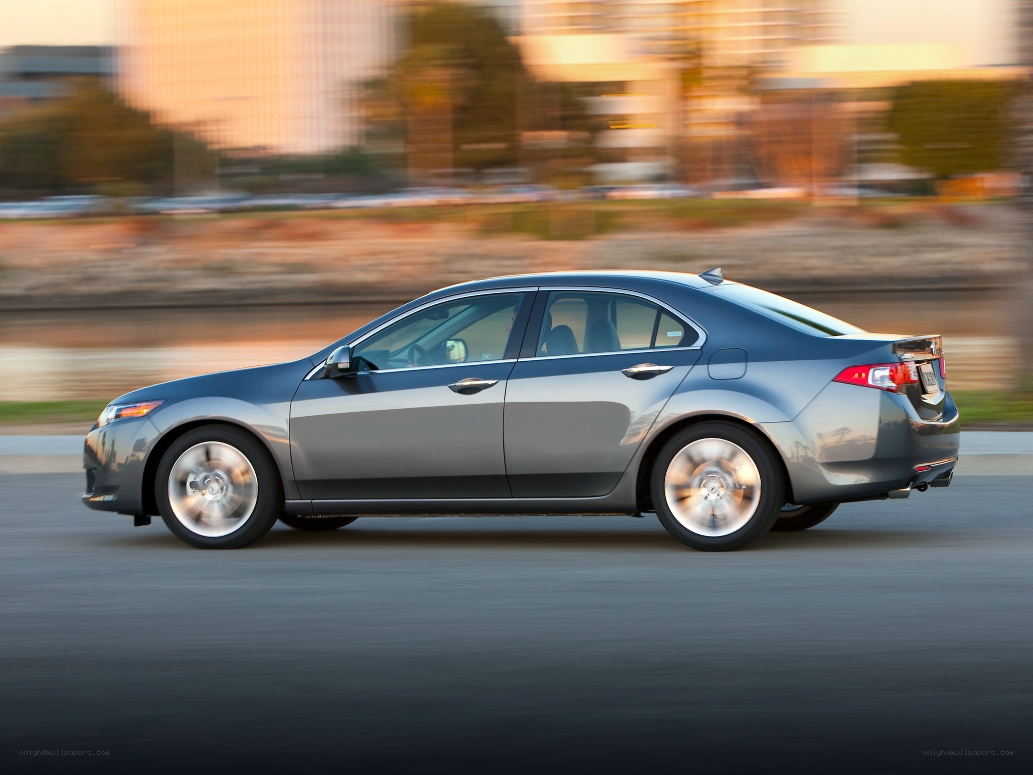 silver sedan in motion