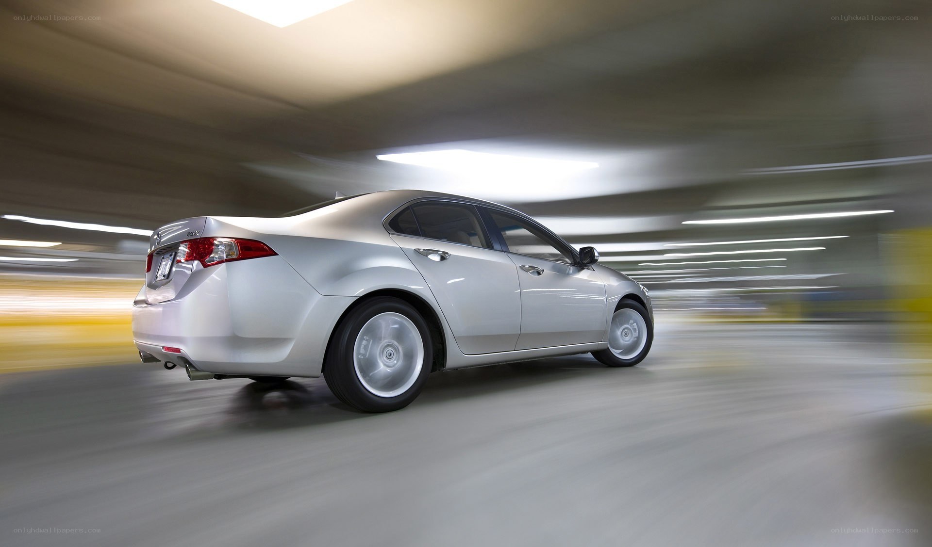 Silver sedan in motion