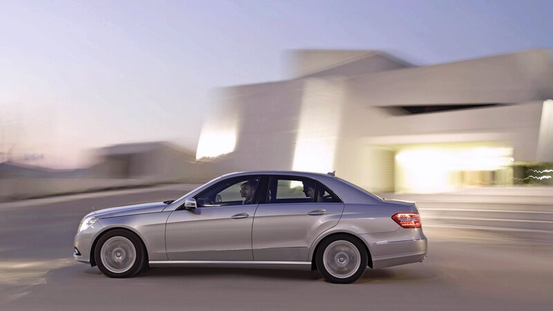 silver sedan in motion