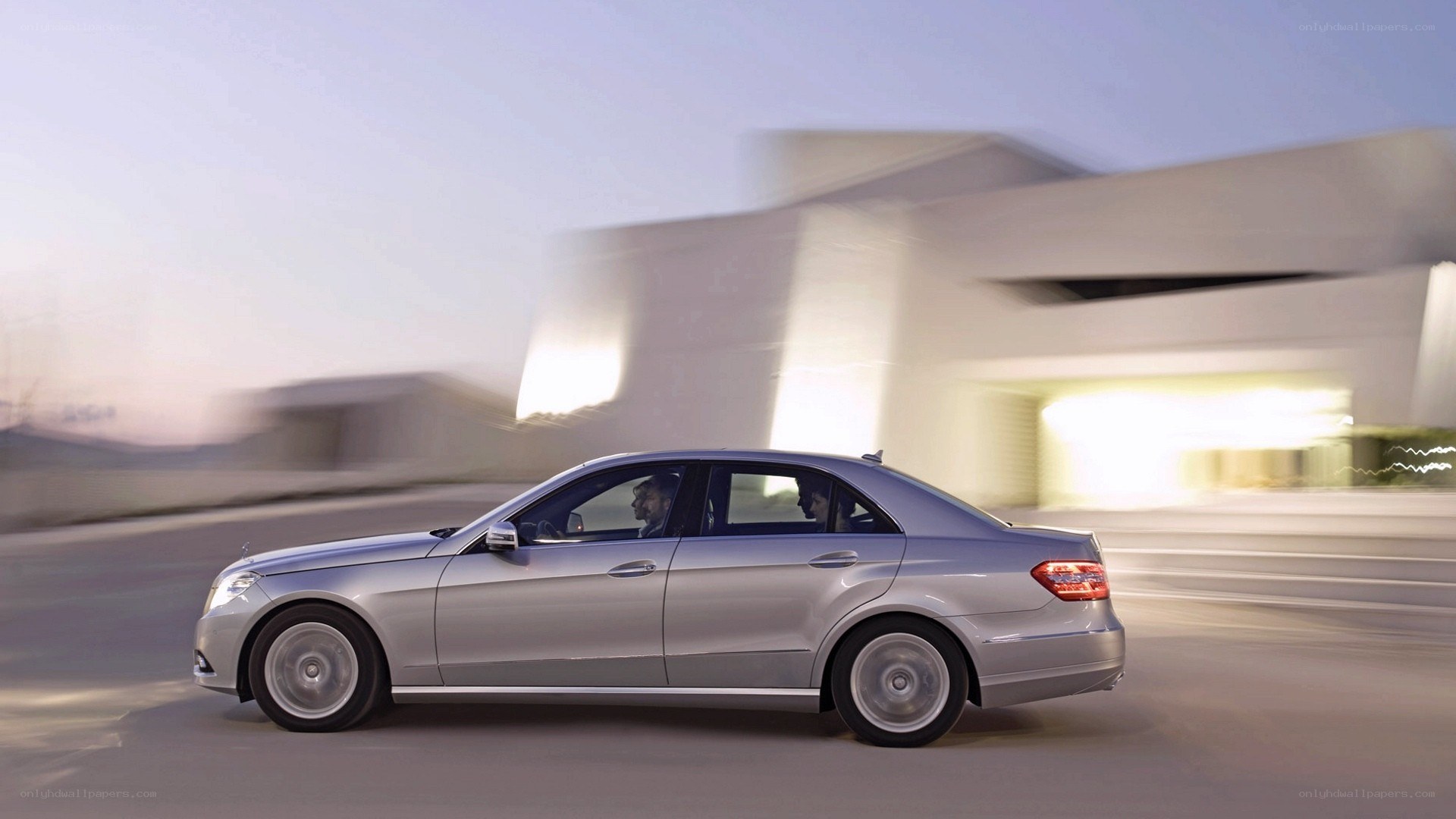 silver sedan in motion