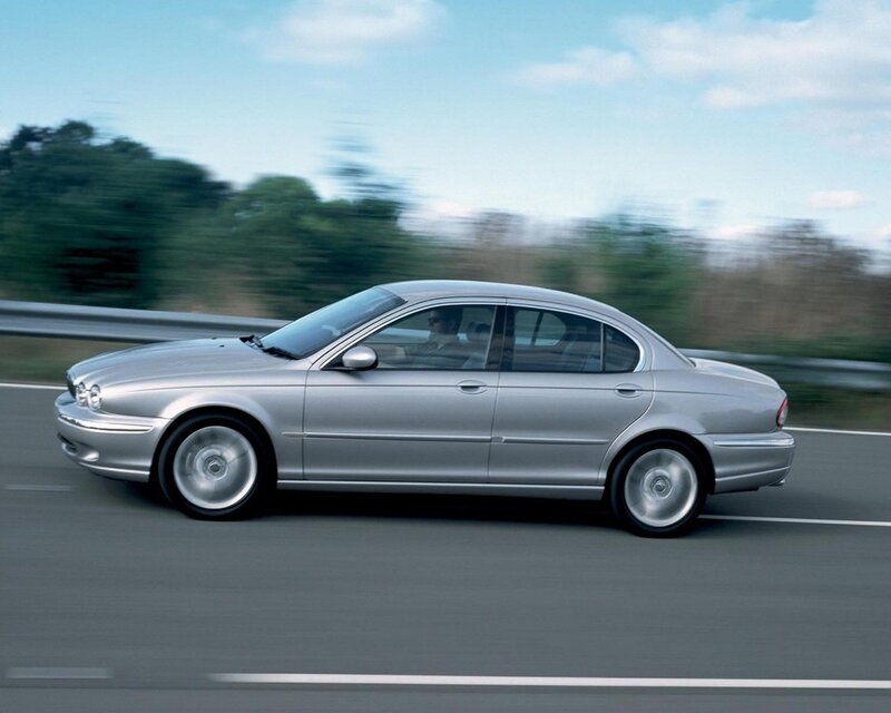silver sedan in motion