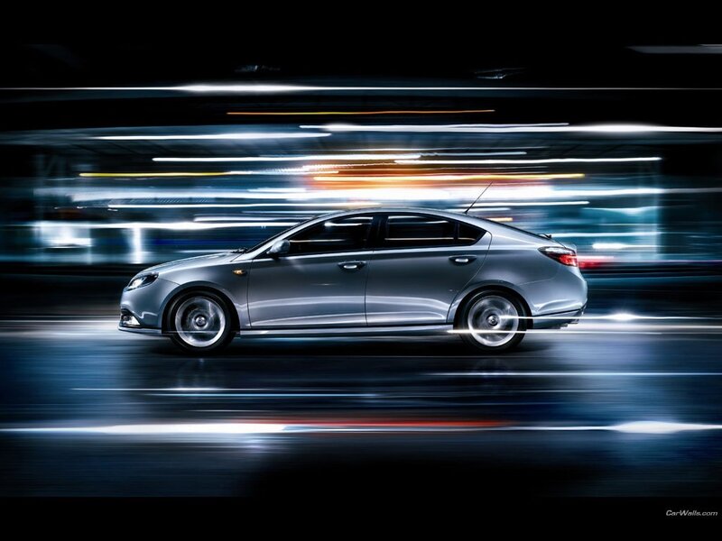 silver sedan in motion