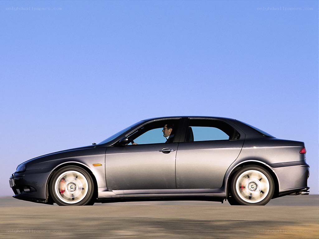 silver sedan in motion