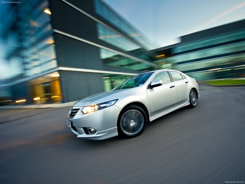 silver sedan in motion