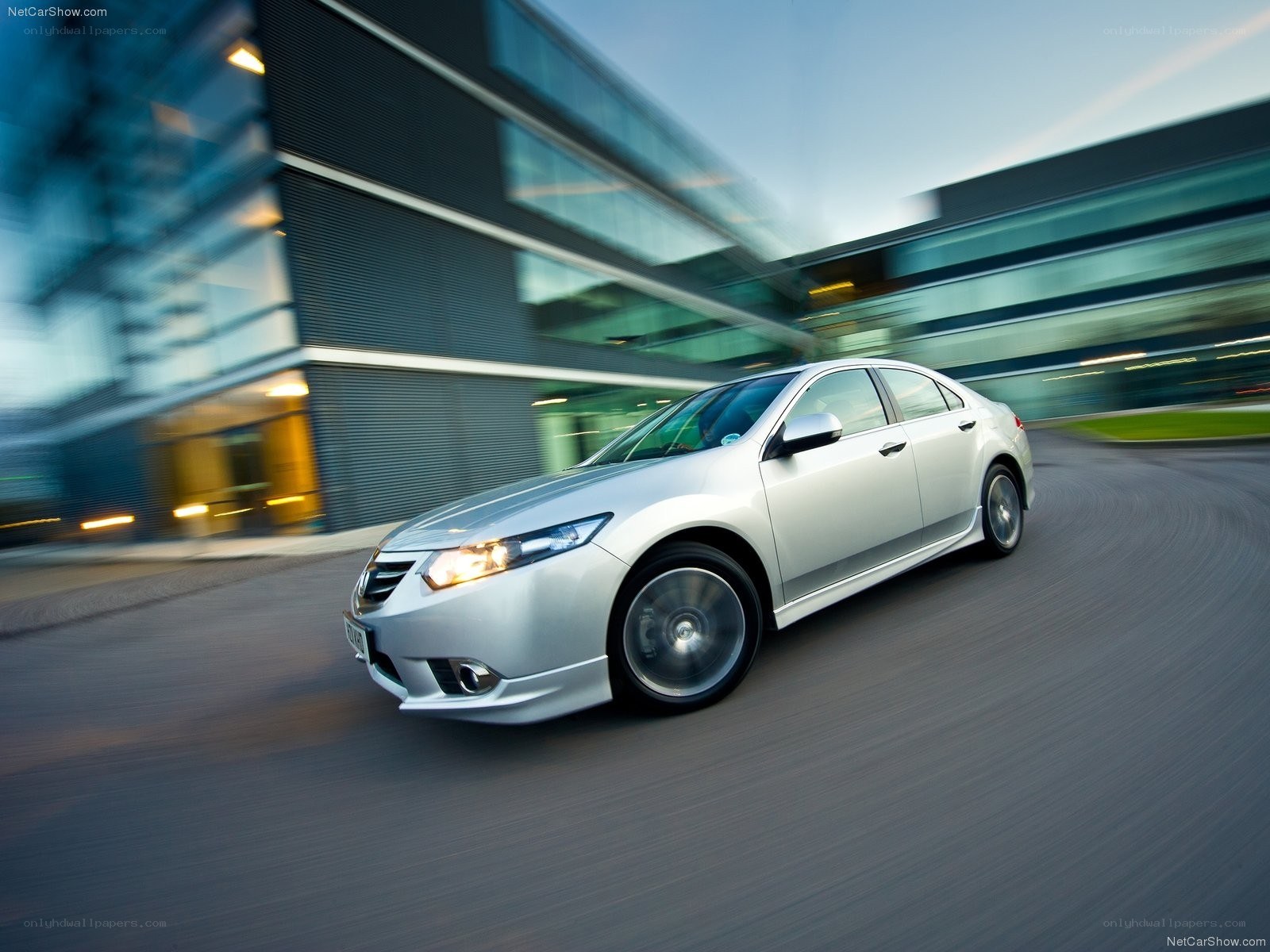 silver sedan in motion