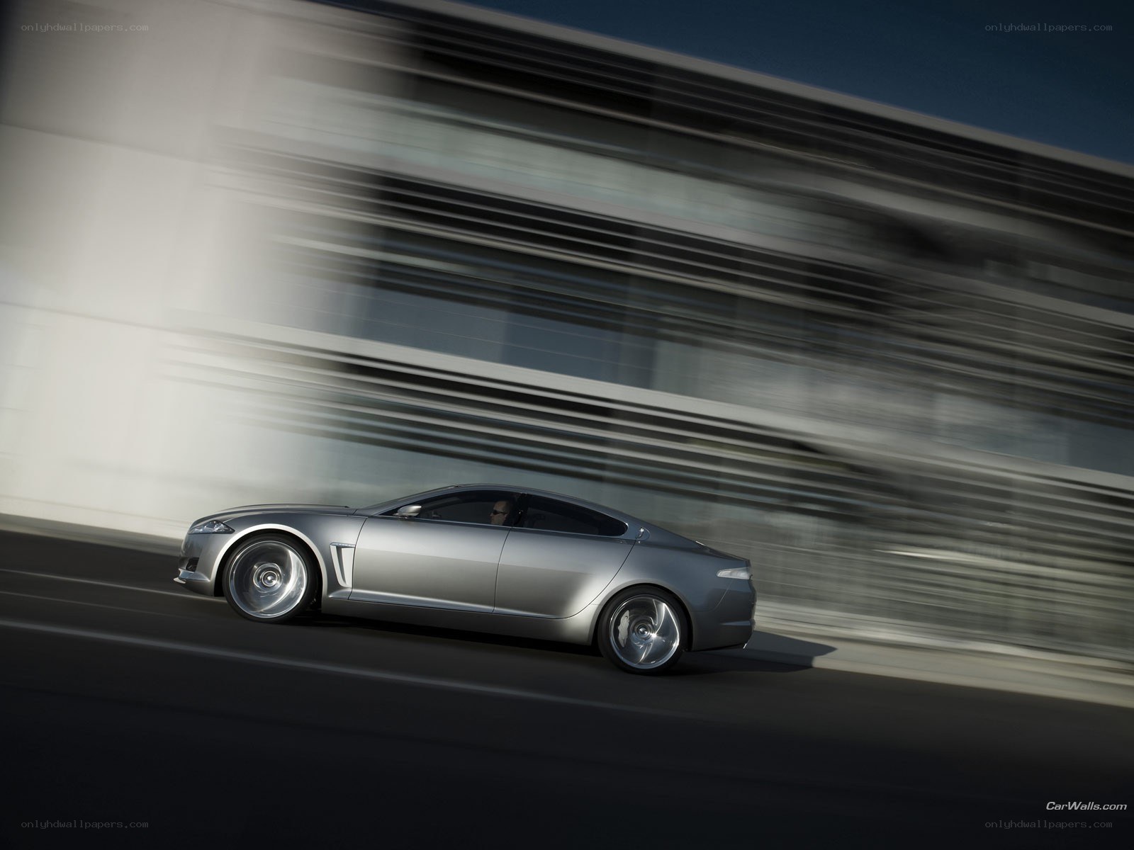 Silver sedan in motion