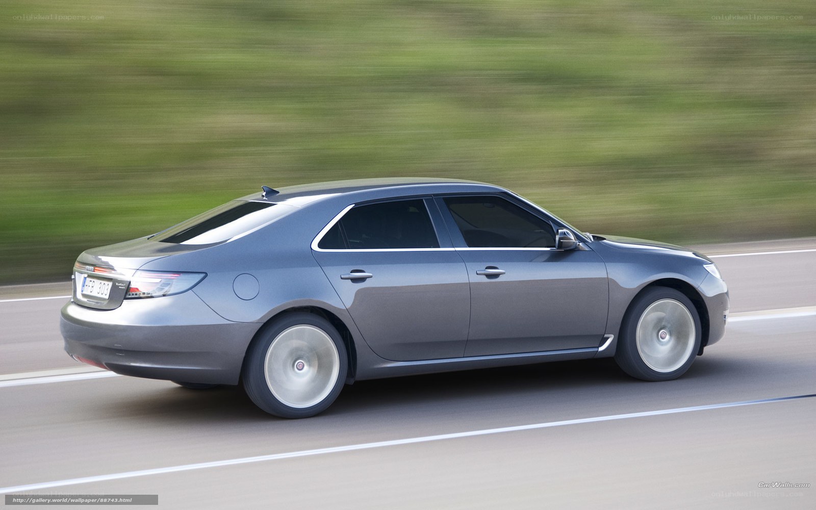 silver sedan in motion