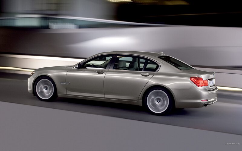 silver sedan in motion