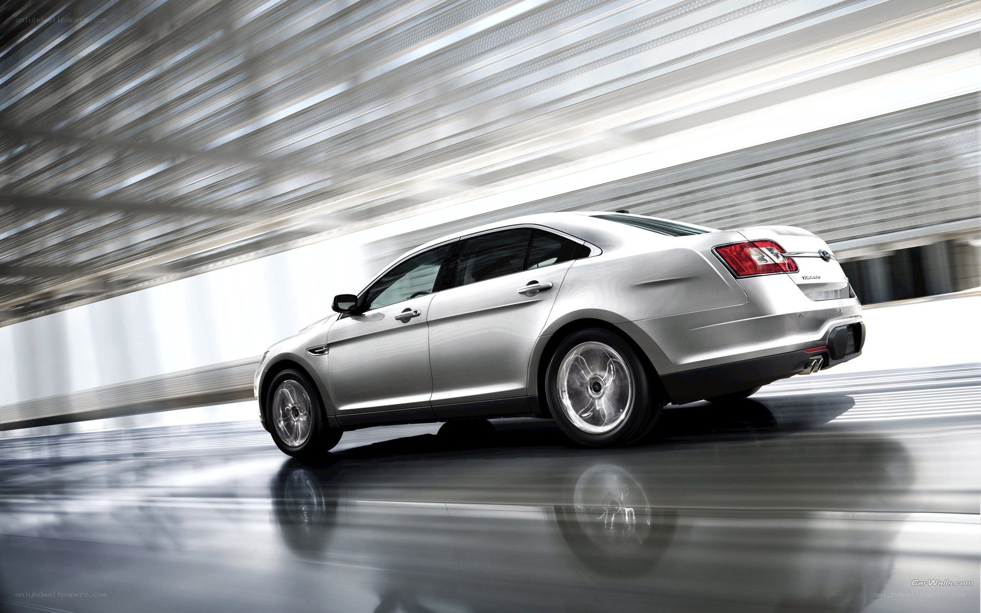 silver sedan in motion