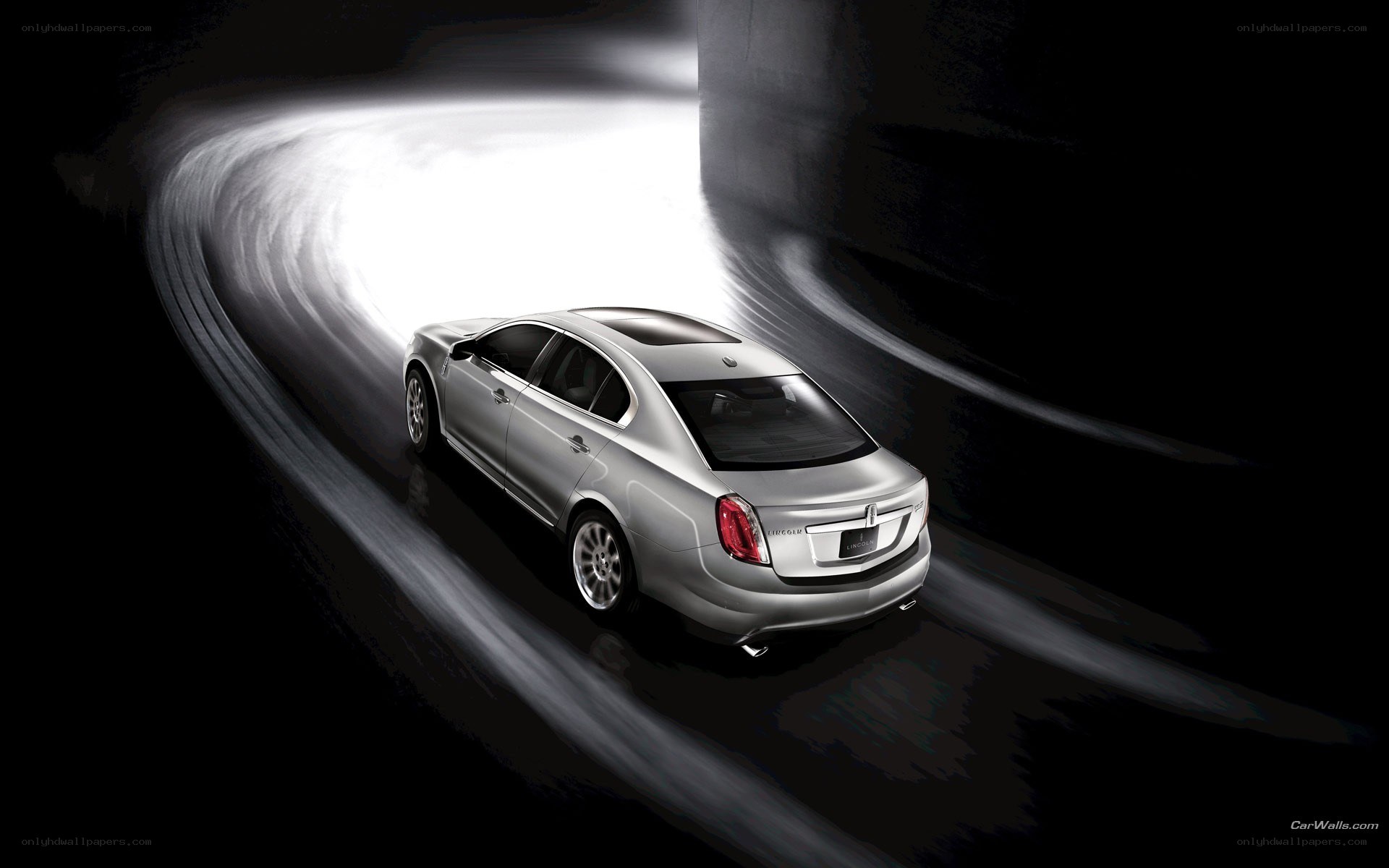 silver sedan in motion