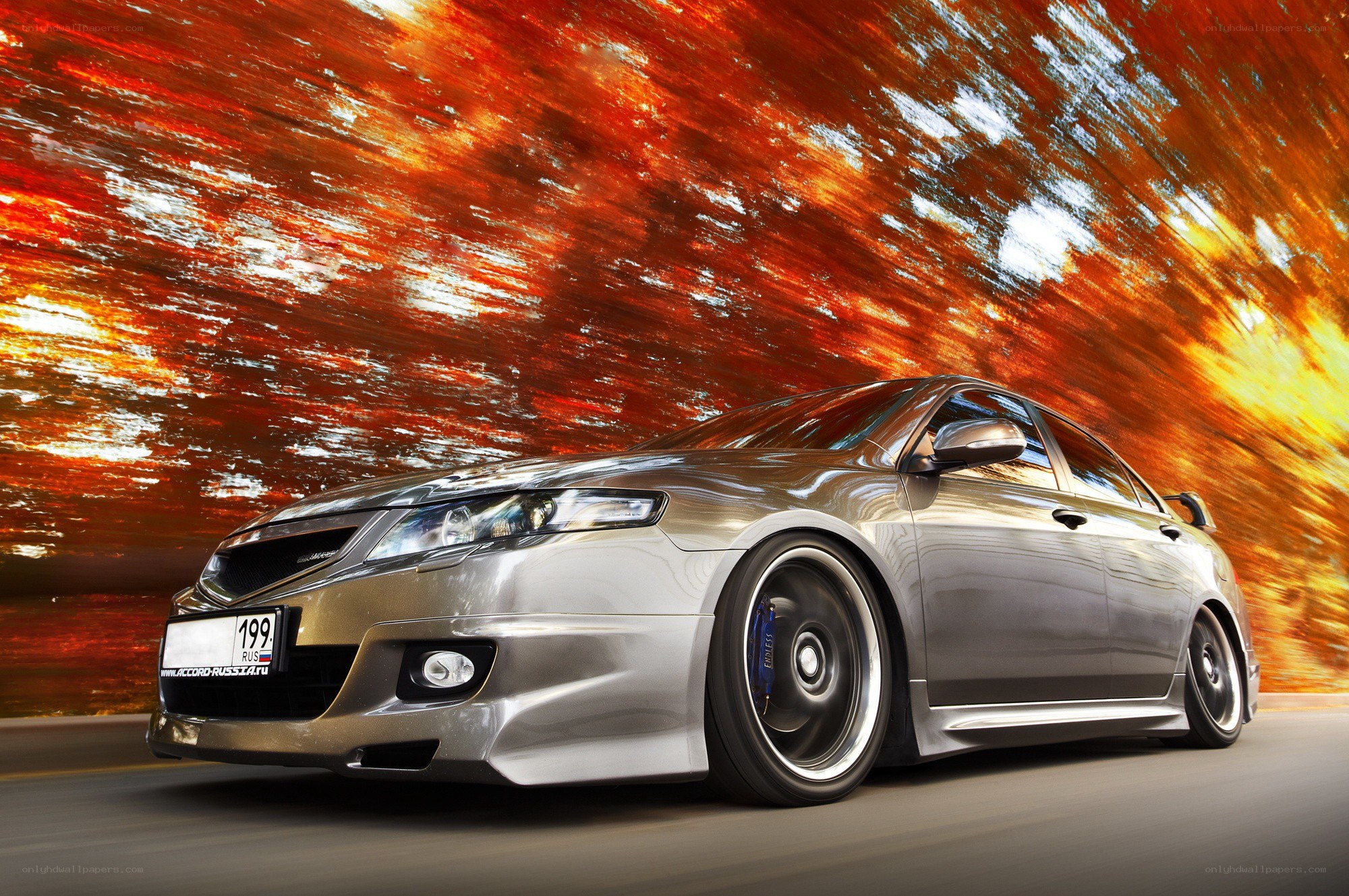 Silver sedan in motion